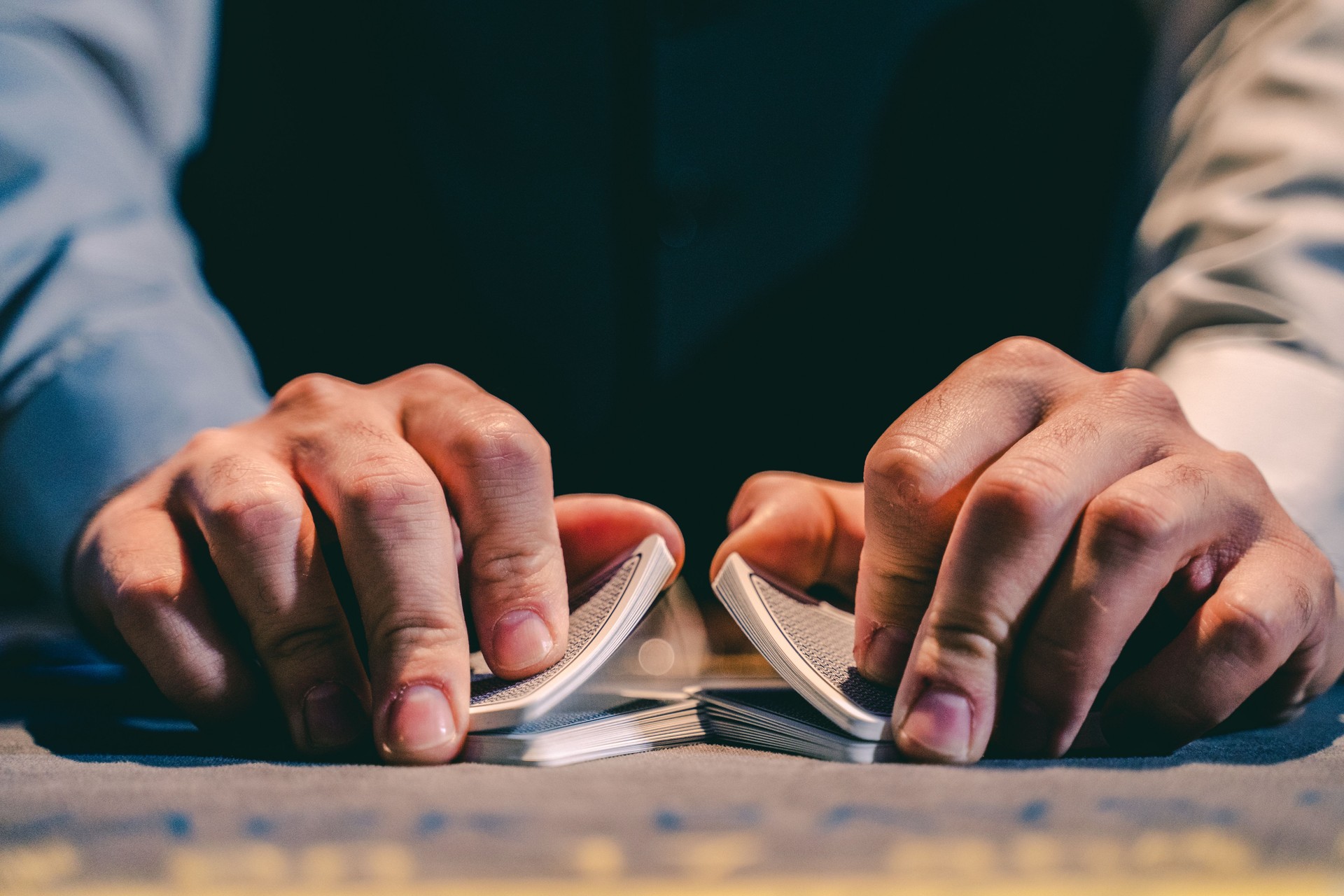 Dealer with cards in a casino